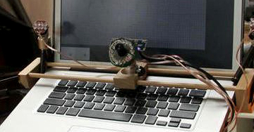 Image is of a computer with an eye tracker made to track eye movements of disabled people to allow for drawing with their eyes as a  part of maker space education