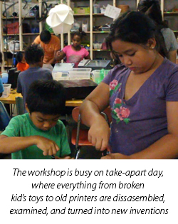 The workshop is busy on take-apart day, where everything from broken kid's toys to old printers are dissasembled, examined, and turned into new inventions